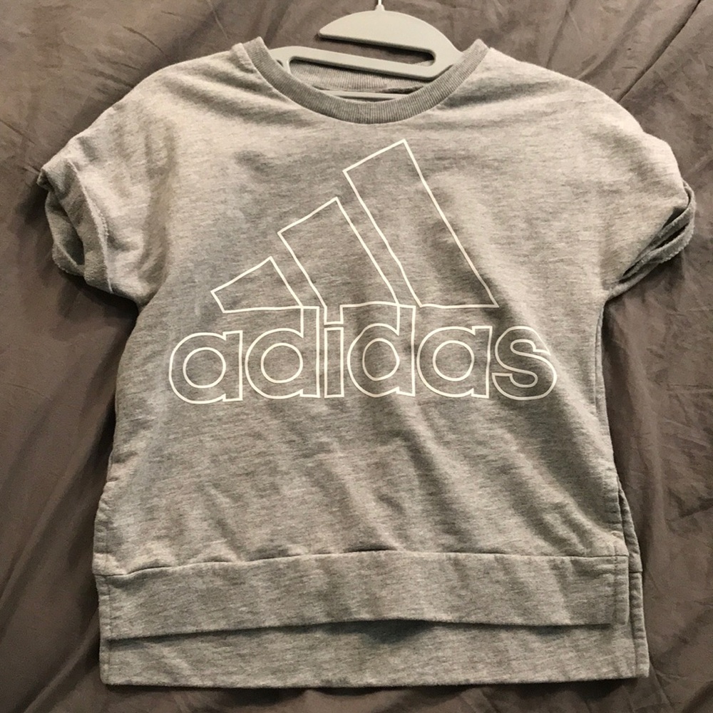 A grey Adidas boxy tee with the logo on the front.